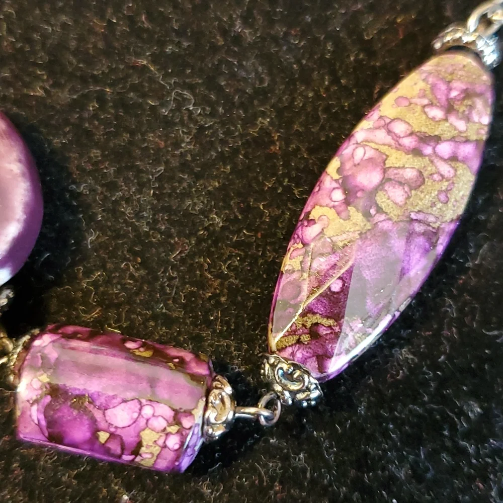 Gunmetal double strand necklace with purple seed bead bows and marble look beads